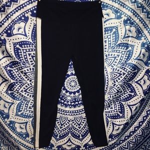 Black leggings with grey and white stripes on side